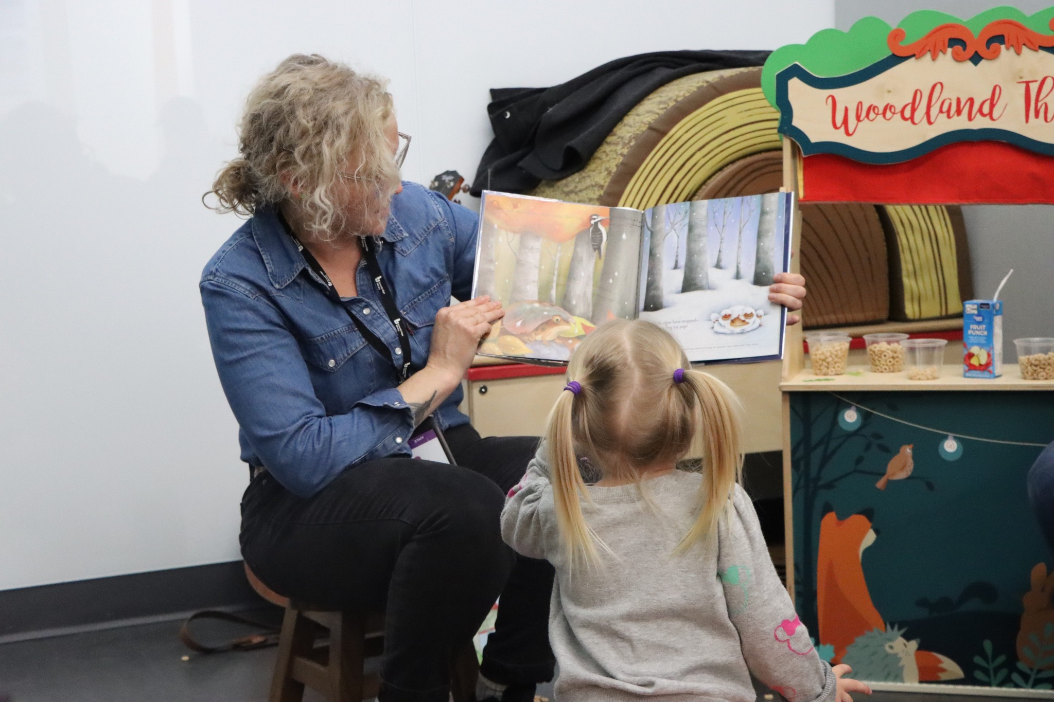 volunteer helping a child with a project